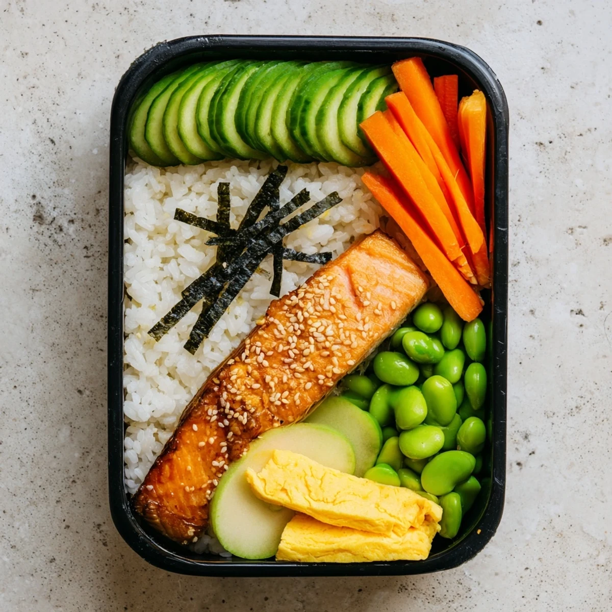 Healthy Japanese breakfast bento box showcasing grilled salmon, steamed rice, pickled vegetables, and fresh fruit arranged in a compartmented container