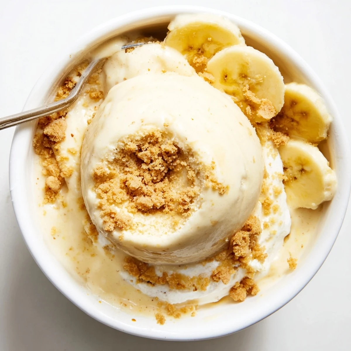 Creamy Ninja Creami Banana Cream Pie Ice Cream topped with whipped cream