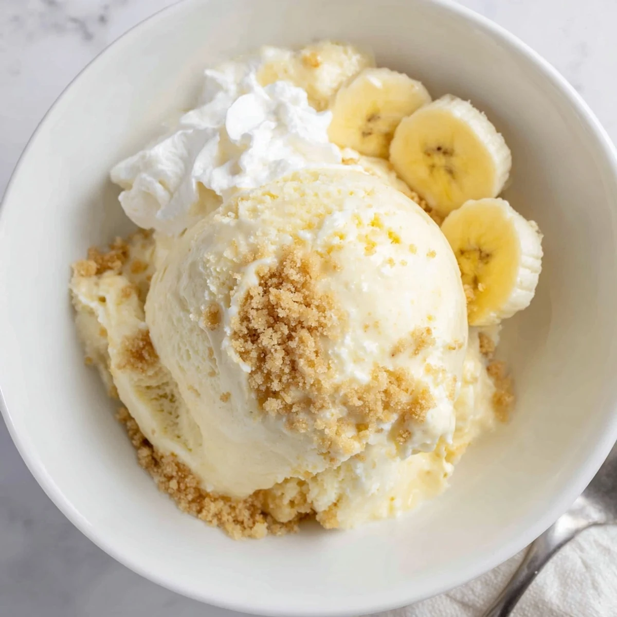 Homestyle Ninja Creami Banana Cream Pie Ice Cream with graham cracker swirl