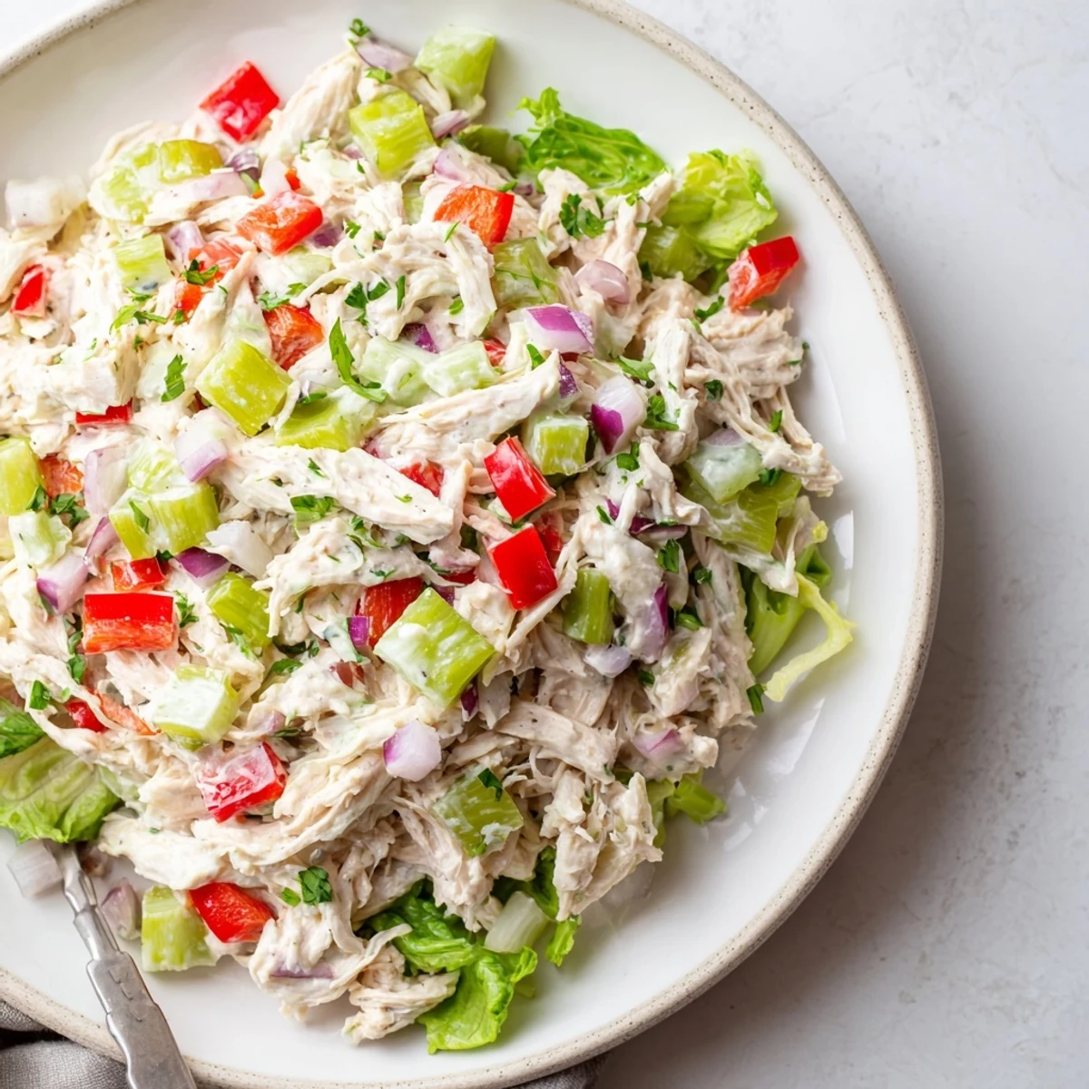 Creamy High Protein Pepperoncini Chicken Salad in whole grain wrap, savory bite