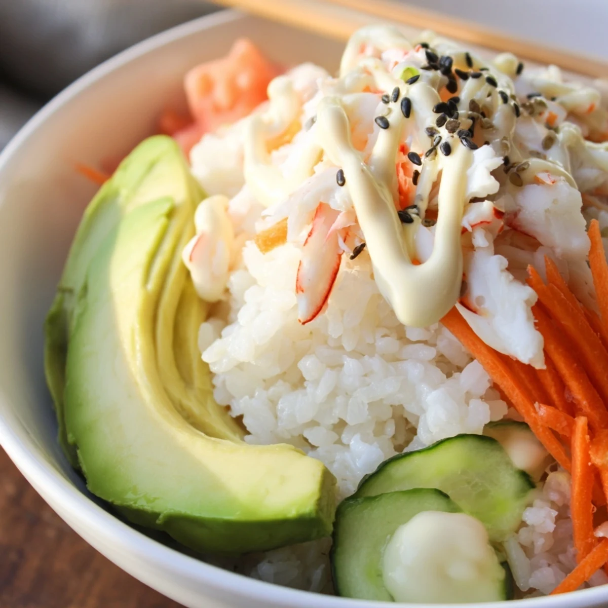 Bright California Roll Sushi Bowls on wooden counter, ready for soy dipping