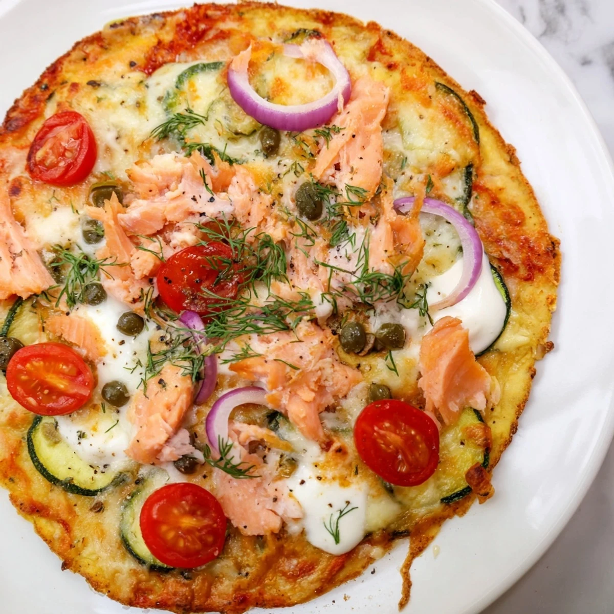 Crispy leftover salmon tortilla pizza topped with melted cheese and fresh dill